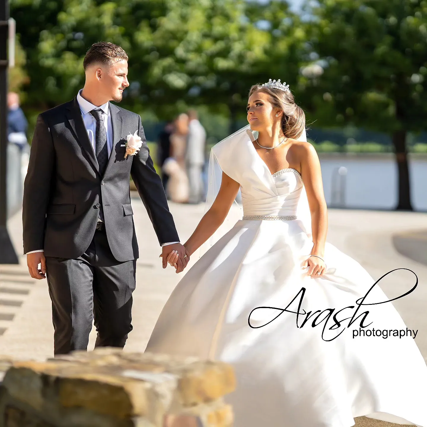 Bride and groom walking hand in hand on their wedding day